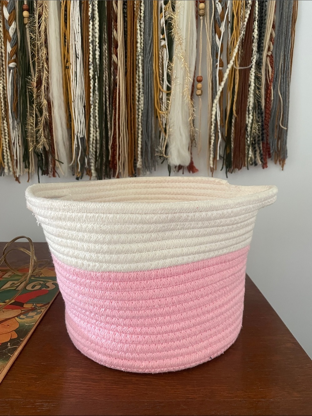 Pink and white braided basket with handles